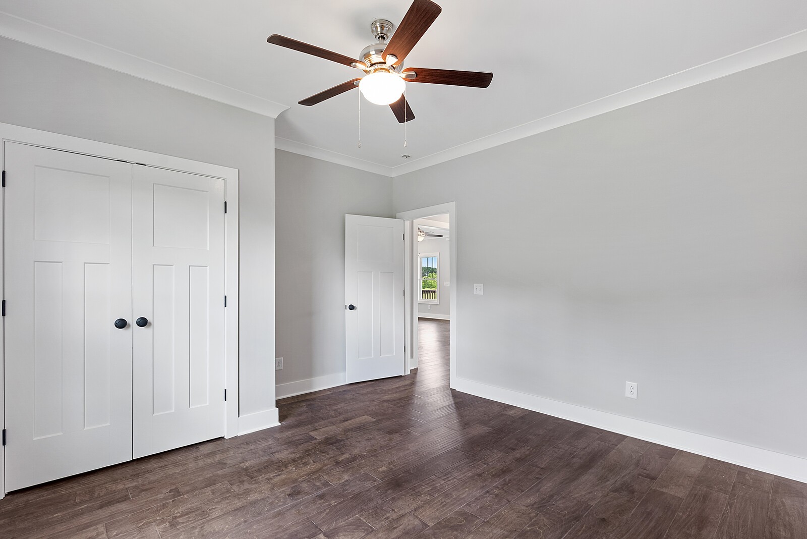 4462 Corbin Sneed Road Springfield, TN 37172 - Photo 17 of 22 an empty room with wooden floor ceiling fan and window