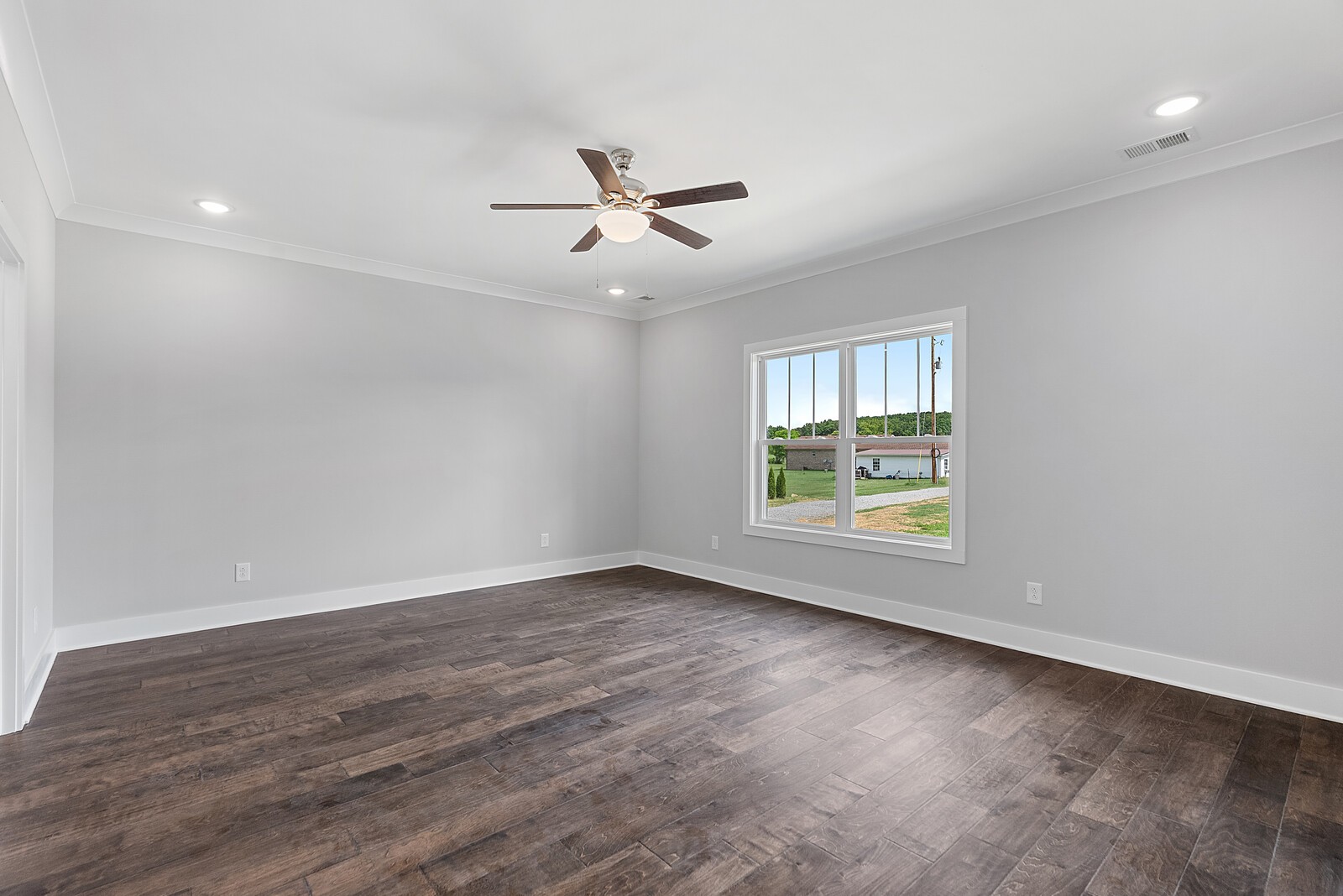 4462 Corbin Sneed Road Springfield, TN 37172 - Photo 10 of 22 an empty room with wooden floor fan and windows