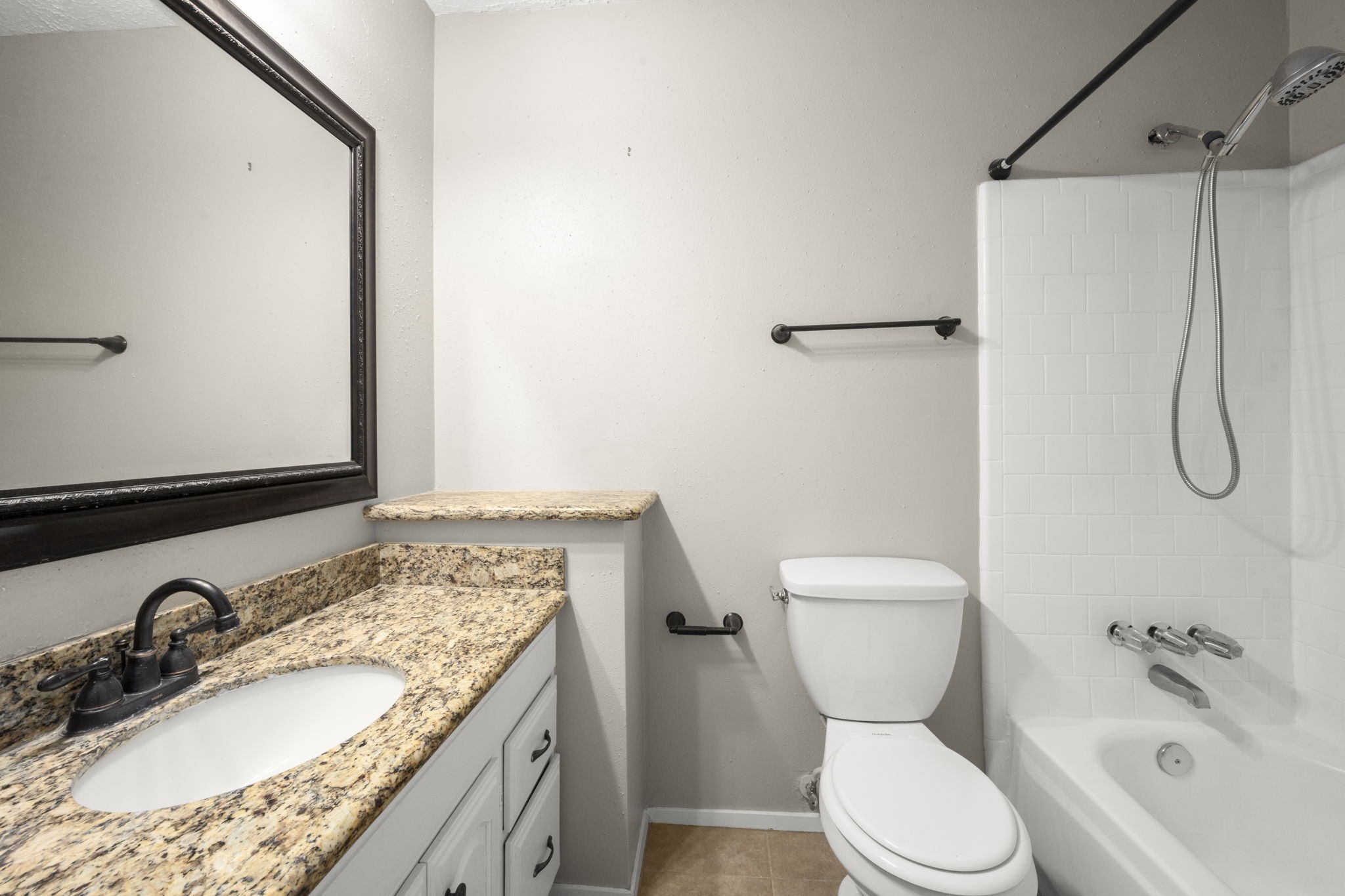 14219 Jaquine Drive Cypress, TX 77429 - Photo 14 of 16 a bathroom with a granite countertop sink toilet and shower