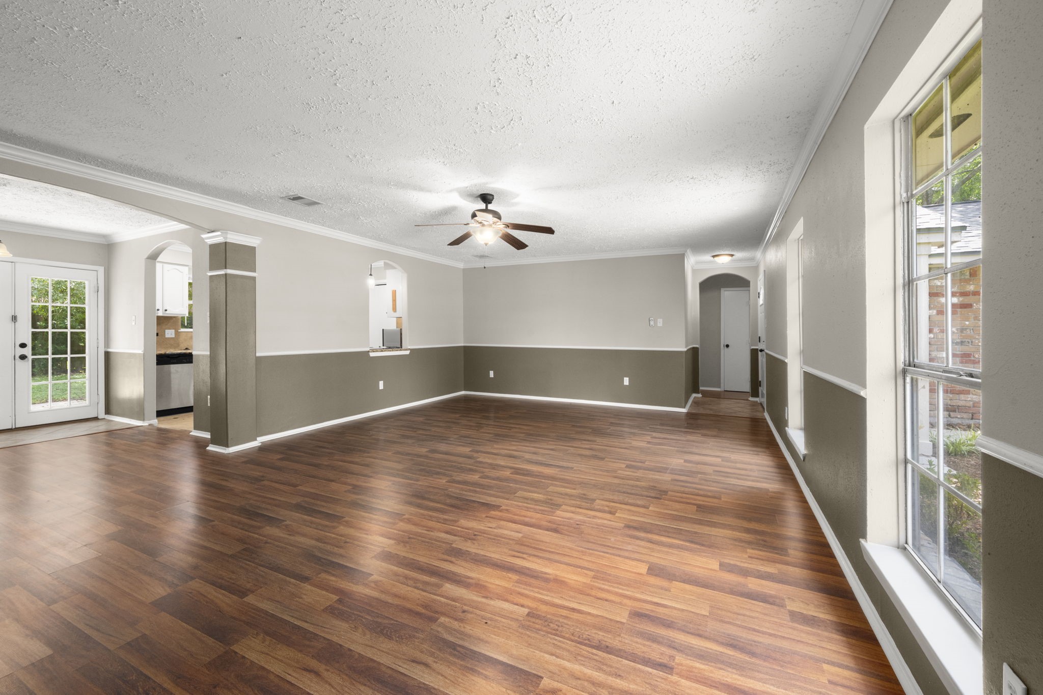 14219 Jaquine Drive Cypress, TX 77429 - Photo 8 of 16 wooden floor in an empty room with a window