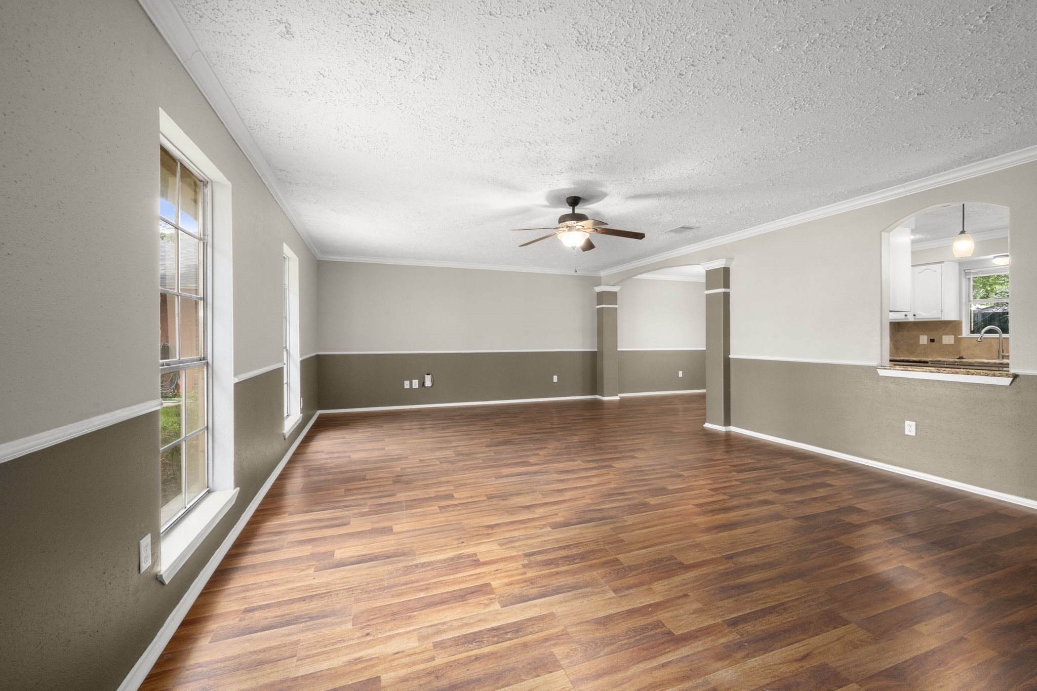 14219 Jaquine Drive Cypress, TX 77429 - Photo 9 of 16 a view of a room with wooden floor and staircase