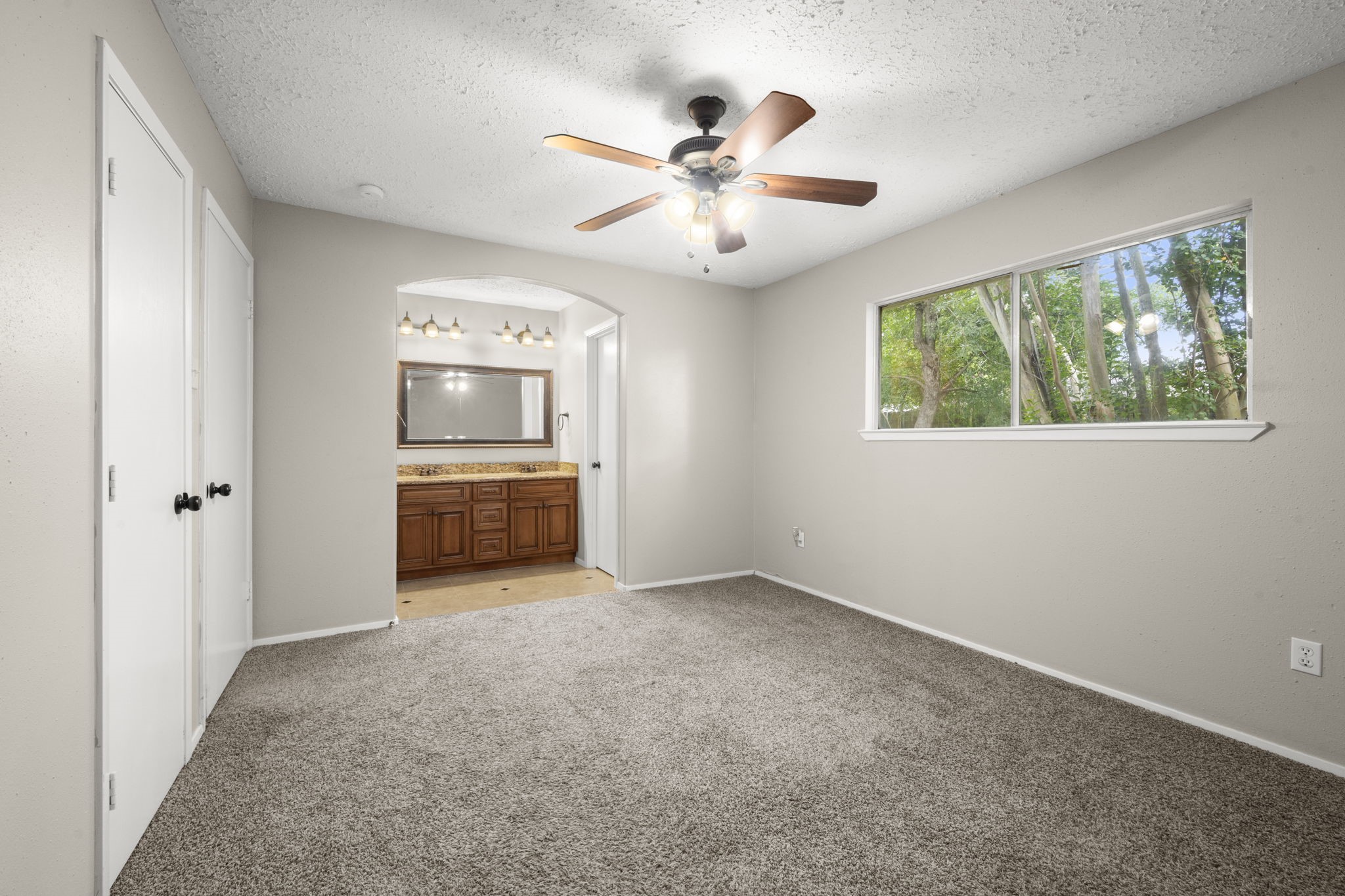 14219 Jaquine Drive Cypress, TX 77429 - Photo 10 of 16 an empty room with fan and windows