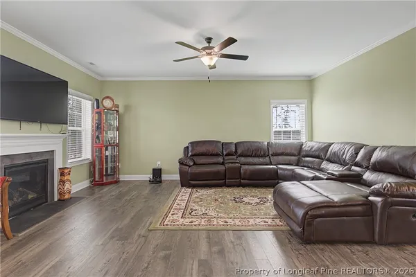 a kitchen with stainless steel appliances white cabinets and a stove top oven