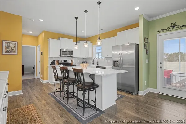 a view of a kitchen and dining room