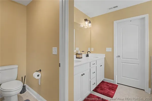 a bedroom with a bed and a cabinets