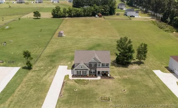 a view of a lake with a yard