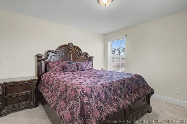 a bedroom with a bed and a closet