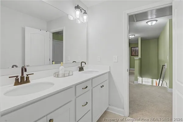 a bedroom with a bed and a tv