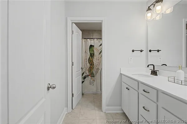 a bedroom with a bed and a television