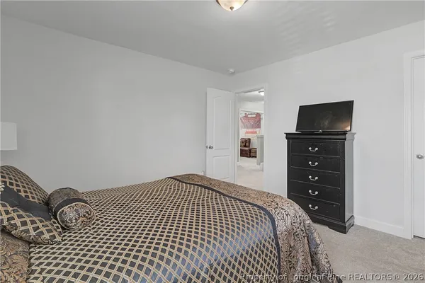 a bedroom with a bed and a closet