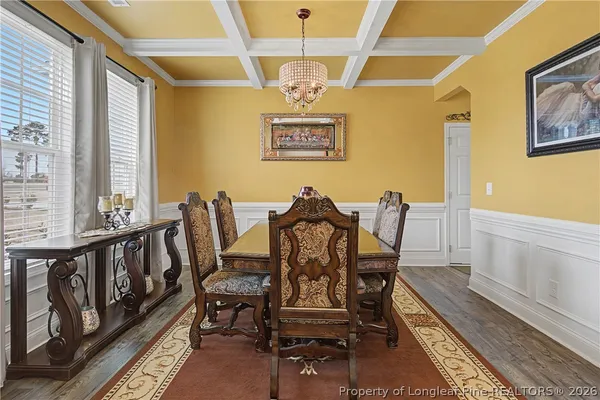 a living room with furniture and a ceiling fan