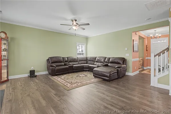a living room with furniture fireplace and flat screen tv