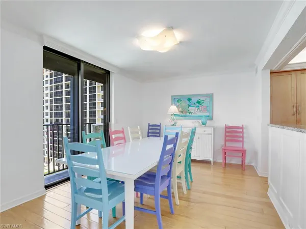 a view of a dining room with furniture and wooden floor
