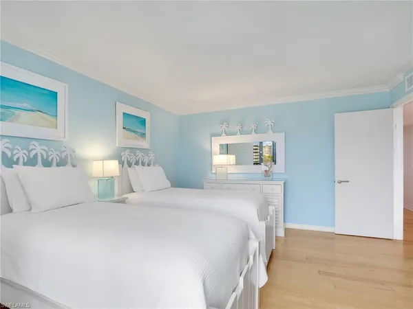 a bedroom with a bed and a night stand