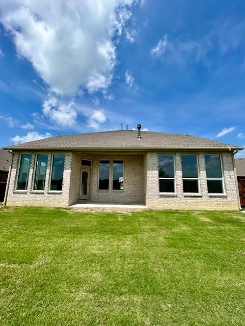 2204 Greenbelt Road Celina, TX 75009 - Photo 9 of 9 Expansive rear elevation featuring a brick exterior and a large grassy area