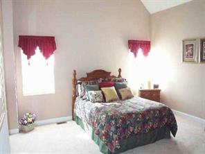 311 Adrian Road Salisbury, NC 28146 - Photo 8 of 8 a bedroom with a bed and a painting on the wall
