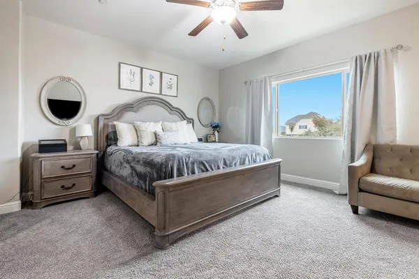 a bathroom with a granite countertop bathtub sink double and mirror