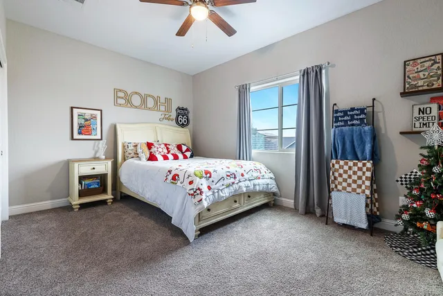 a bedroom with furniture and a window