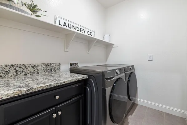 a view of a chair and table in the patio