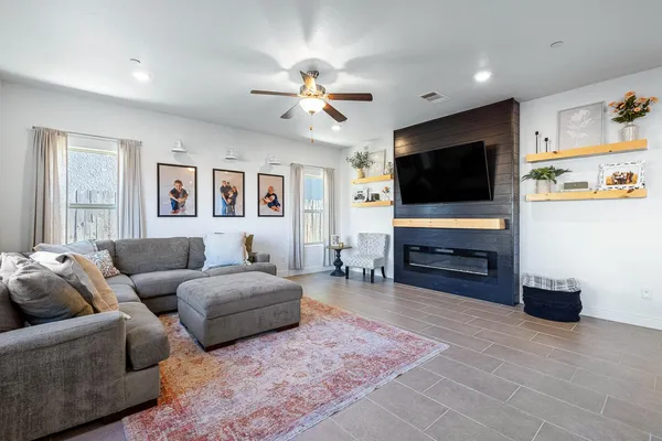 a living room with furniture and a fireplace
