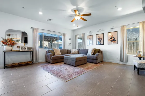 a dining area with furniture and a kitchen