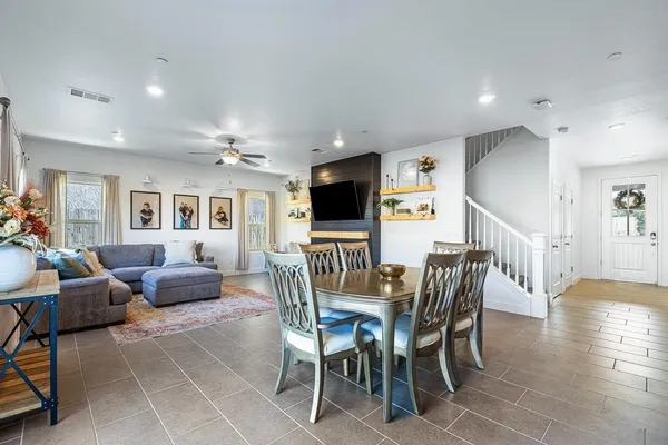 a kitchen with granite countertop a sink dishwasher stove and cabinets with wooden floor