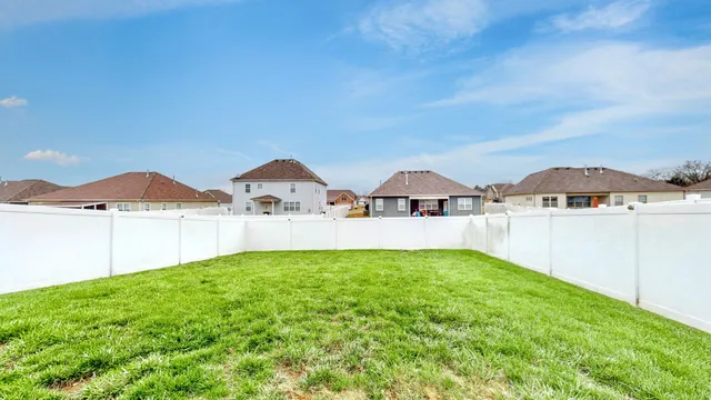 a view of multiple houses with yard