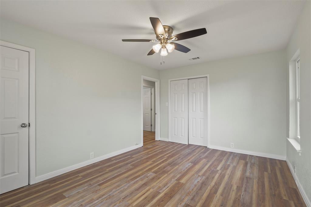 732 Bullock Street Denison, TX 75020 - Photo 18 of 29 a view of empty room with wooden floor