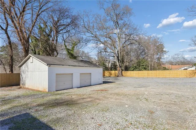 a view of house with a yard