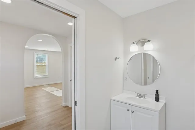 a bathroom with a sink and a mirror