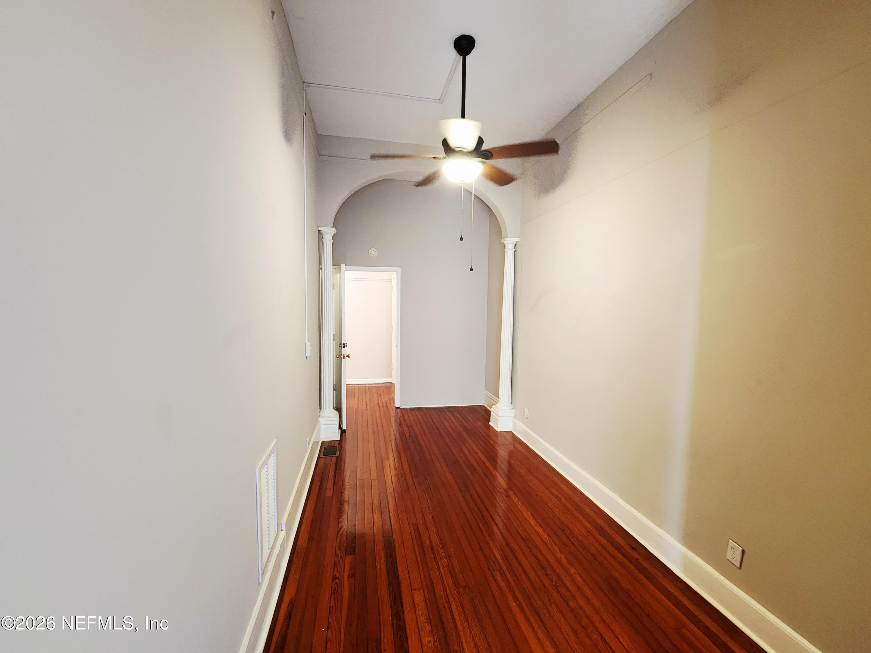 1719 Aberdeen Street Jacksonville, FL 32205 - Photo 14 of 17 a view of a room with wooden floor closet and a ceiling fan