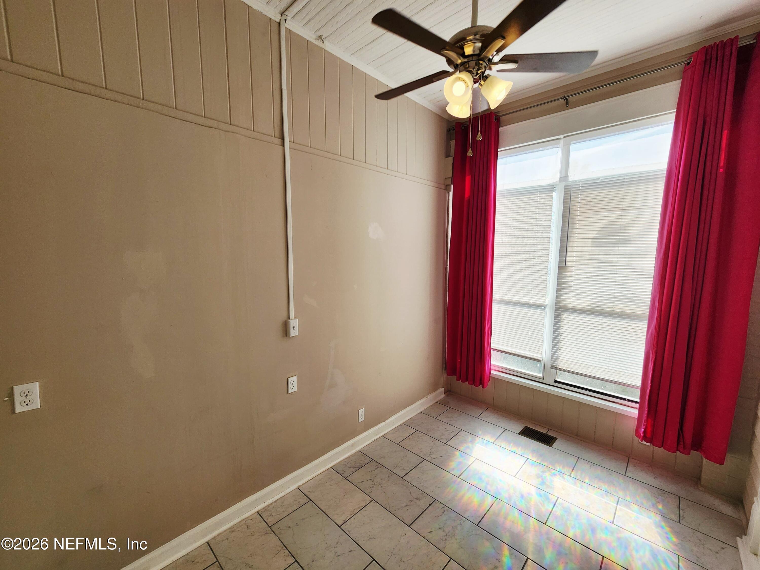 1719 Aberdeen Street Jacksonville, FL 32205 - Photo 17 of 17 a view of a livingroom with a window and a ceiling fan