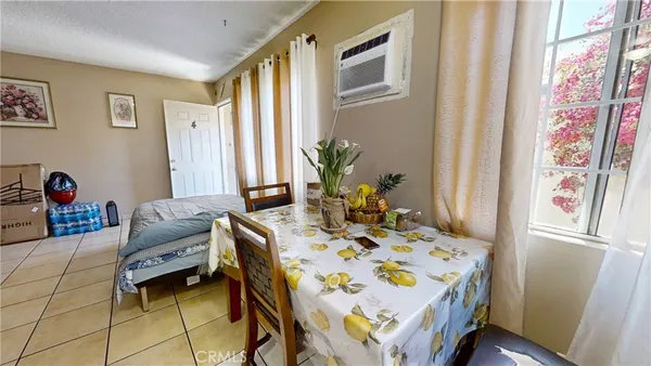 a bedroom that has a bed and a table in it