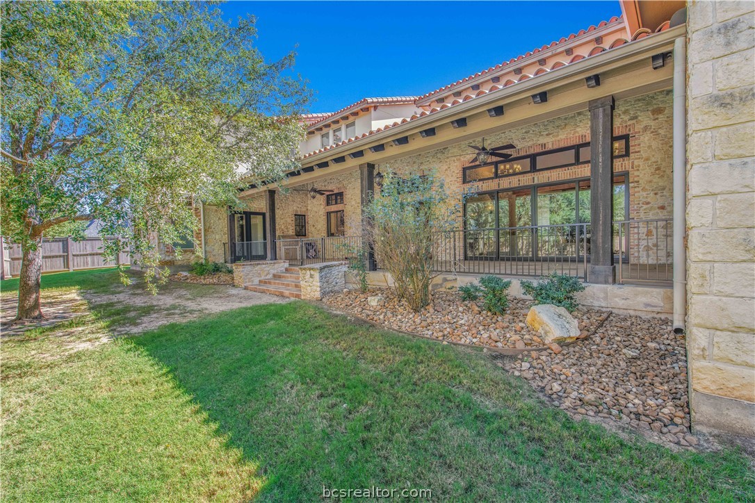 4207 Tuscany Court Bryan, TX 77802 - Photo 41 of 46 a front view of a house with a garden and outdoor seating