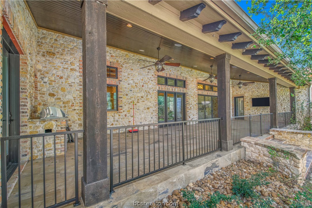 4207 Tuscany Court Bryan, TX 77802 - Photo 42 of 46 a porch with a table and chairs