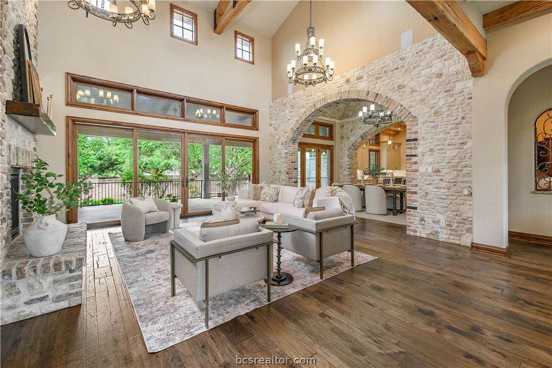 4207 Tuscany Court Bryan, TX 77802 - Photo 7 of 46 a living room with fireplace furniture and a large window