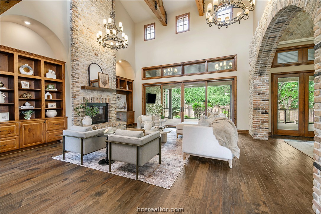 4207 Tuscany Court Bryan, TX 77802 - Photo 8 of 46 a living room with fireplace furniture and a large window