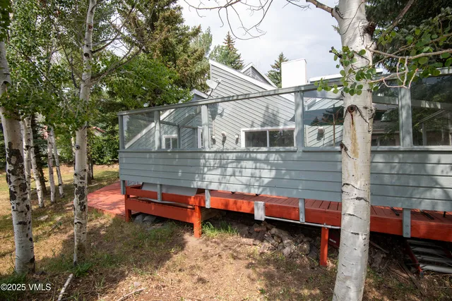 an aerial view of a house with outdoor space and lake view