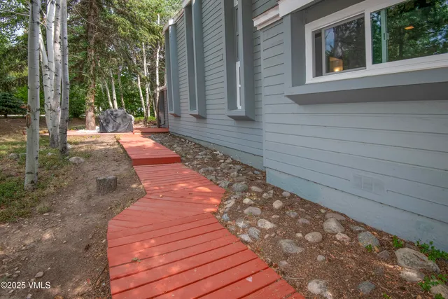 an aerial view of lake houses and trees