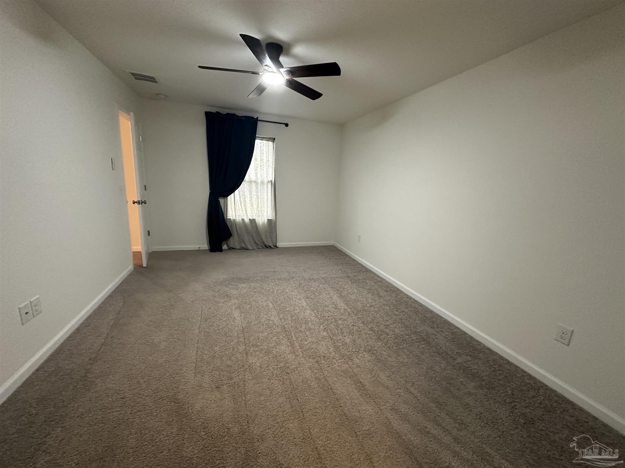 8752 Schooner Lane Pensacola, FL 32507 - Photo 7 of 13 an empty room with windows