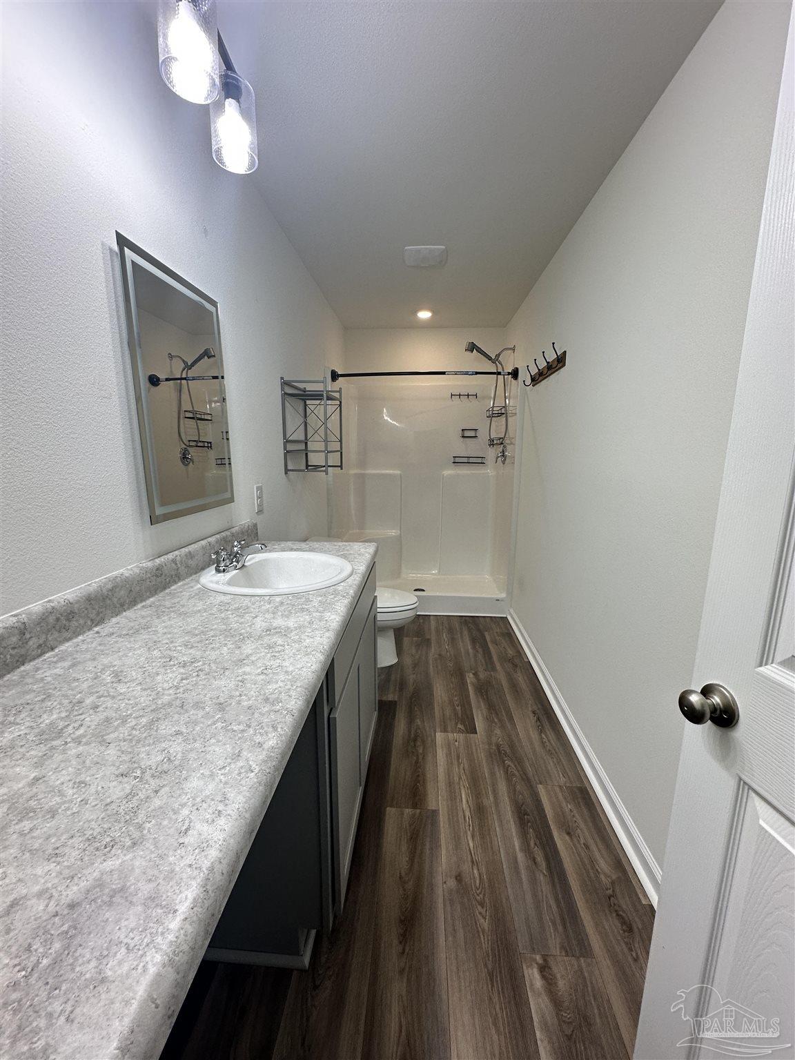 8752 Schooner Lane Pensacola, FL 32507 - Photo 8 of 13 a bathroom with a granite countertop sink