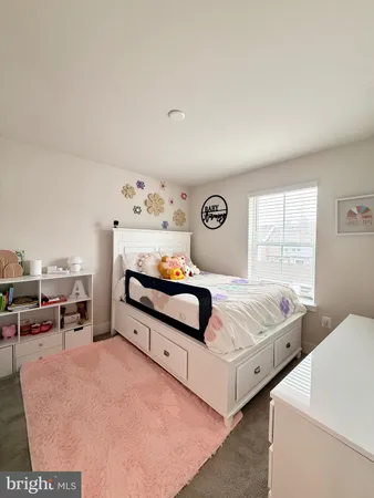 a bedroom with furniture and window