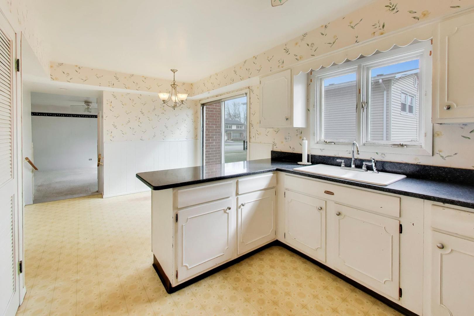 2703 North Ridge Avenue Arlington Heights, IL 60004 - Photo 14 of 51 a bathroom with a sink and a mirror