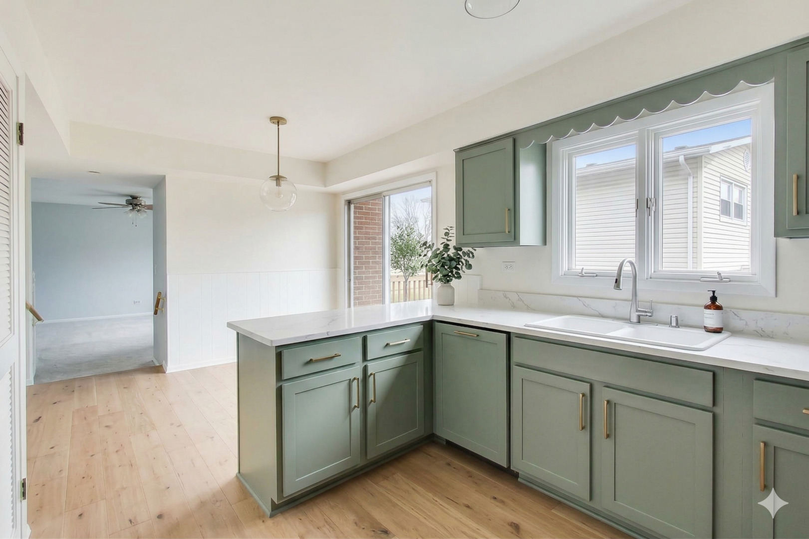 2703 North Ridge Avenue Arlington Heights, IL 60004 - Photo 15 of 51 a kitchen with a sink cabinets and wooden floor