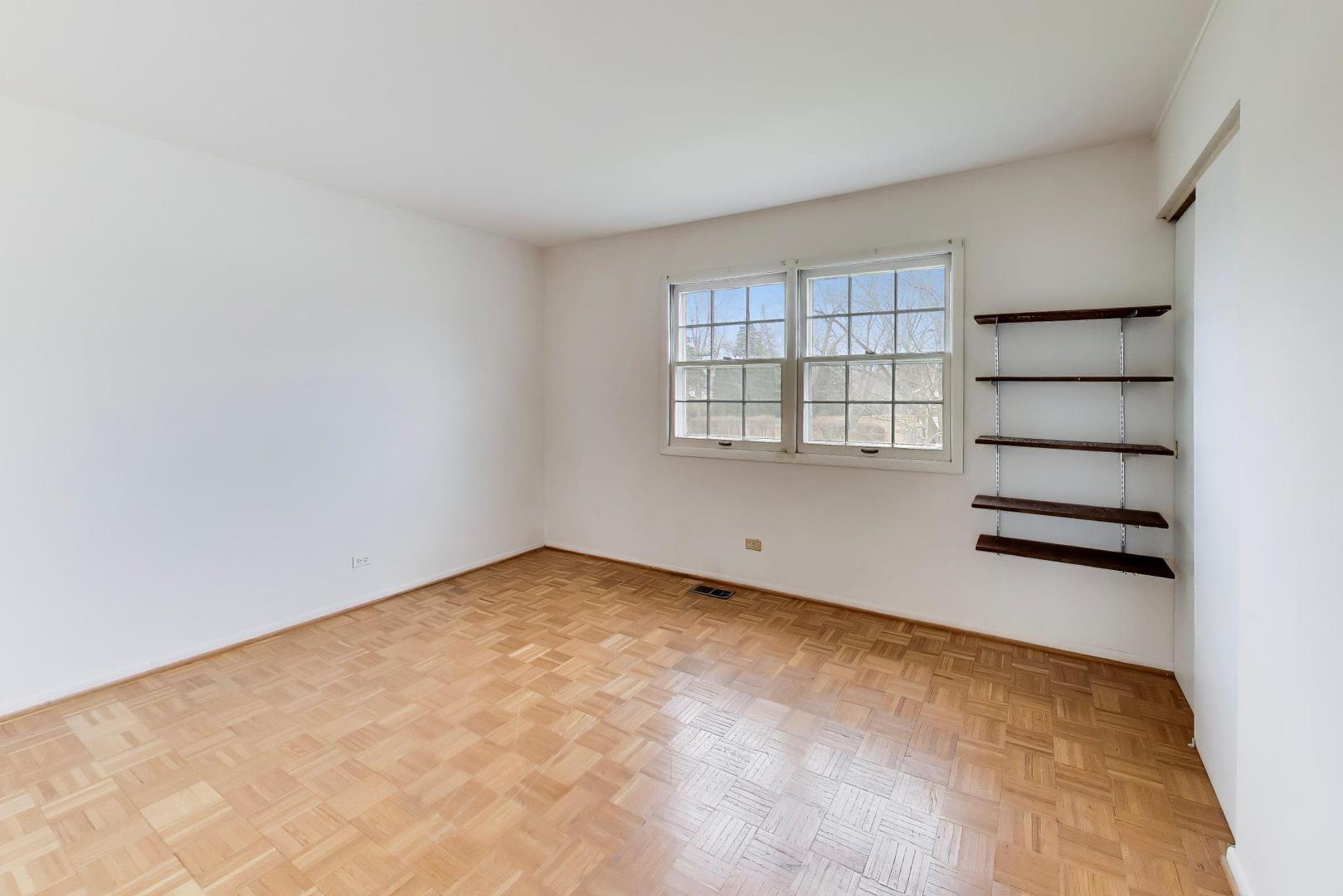2703 North Ridge Avenue Arlington Heights, IL 60004 - Photo 29 of 51 an empty room with windows