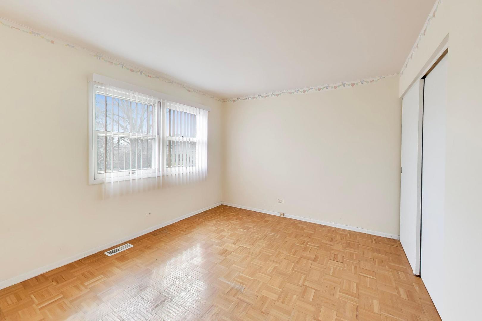 2703 North Ridge Avenue Arlington Heights, IL 60004 - Photo 31 of 51 a view of an empty room with a window