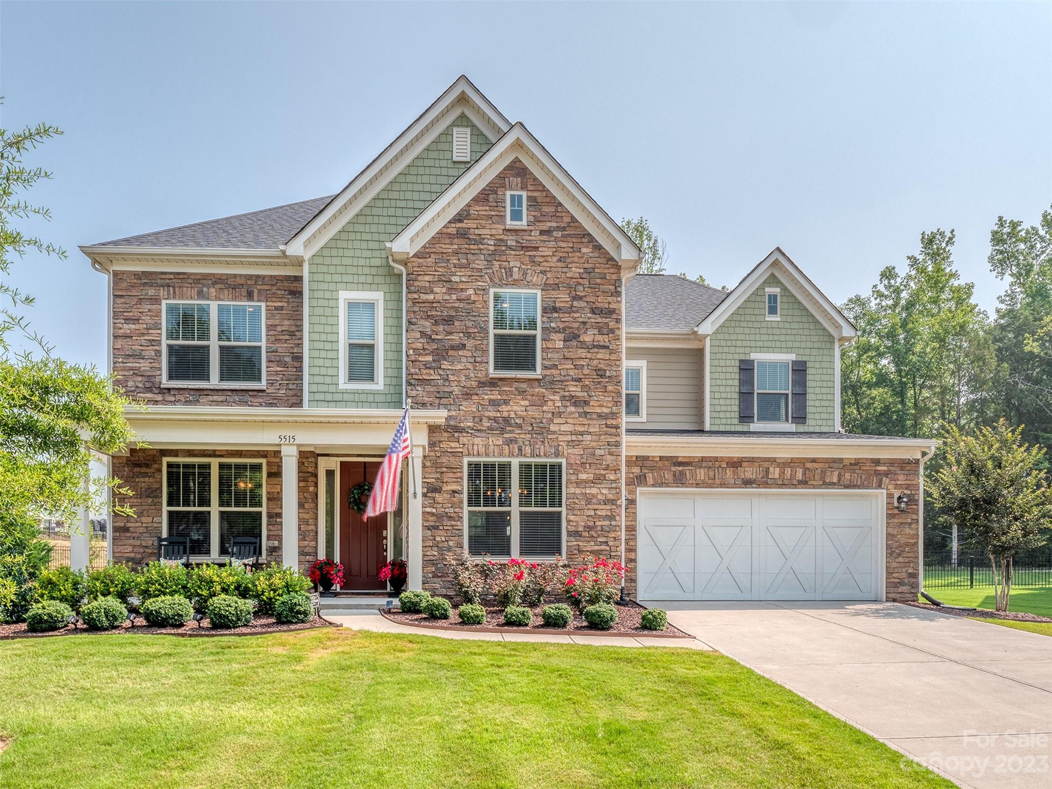 front view of a house with a yard