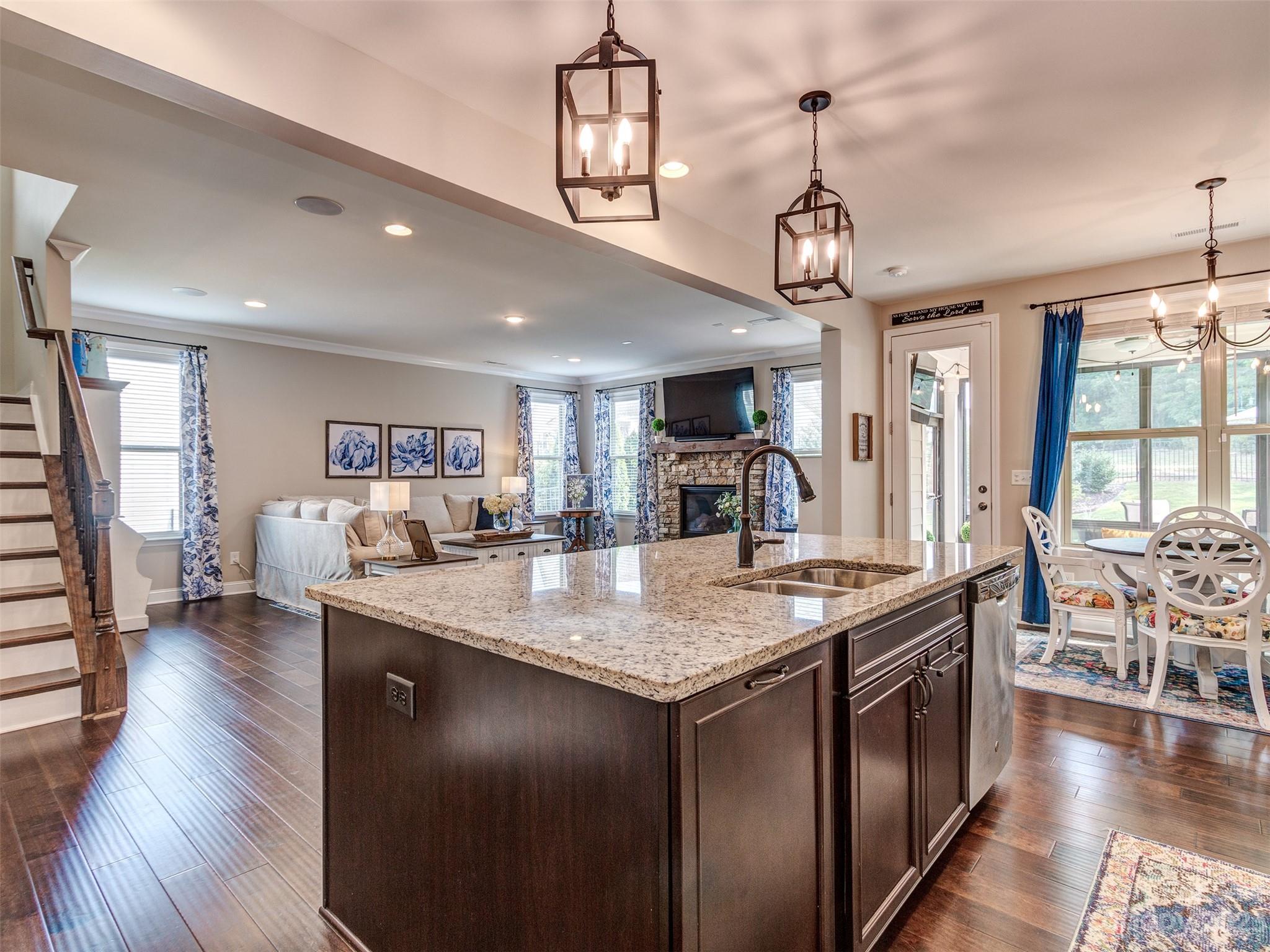 5515 Braddock Ml Way Lancaster, SC 29720 - Photo 13 of 41 a view of a dining room and livingroom with furniture wooden floor a chandelier