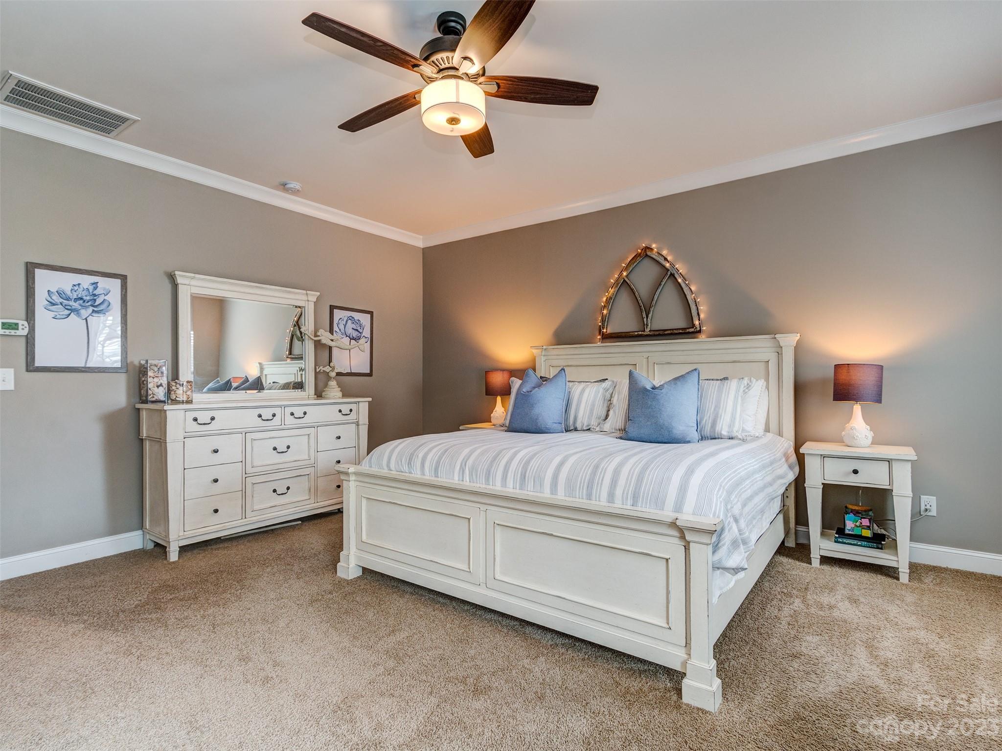 5515 Braddock Ml Way Lancaster, SC 29720 - Photo 18 of 41 a bedroom with a bed and a chandelier