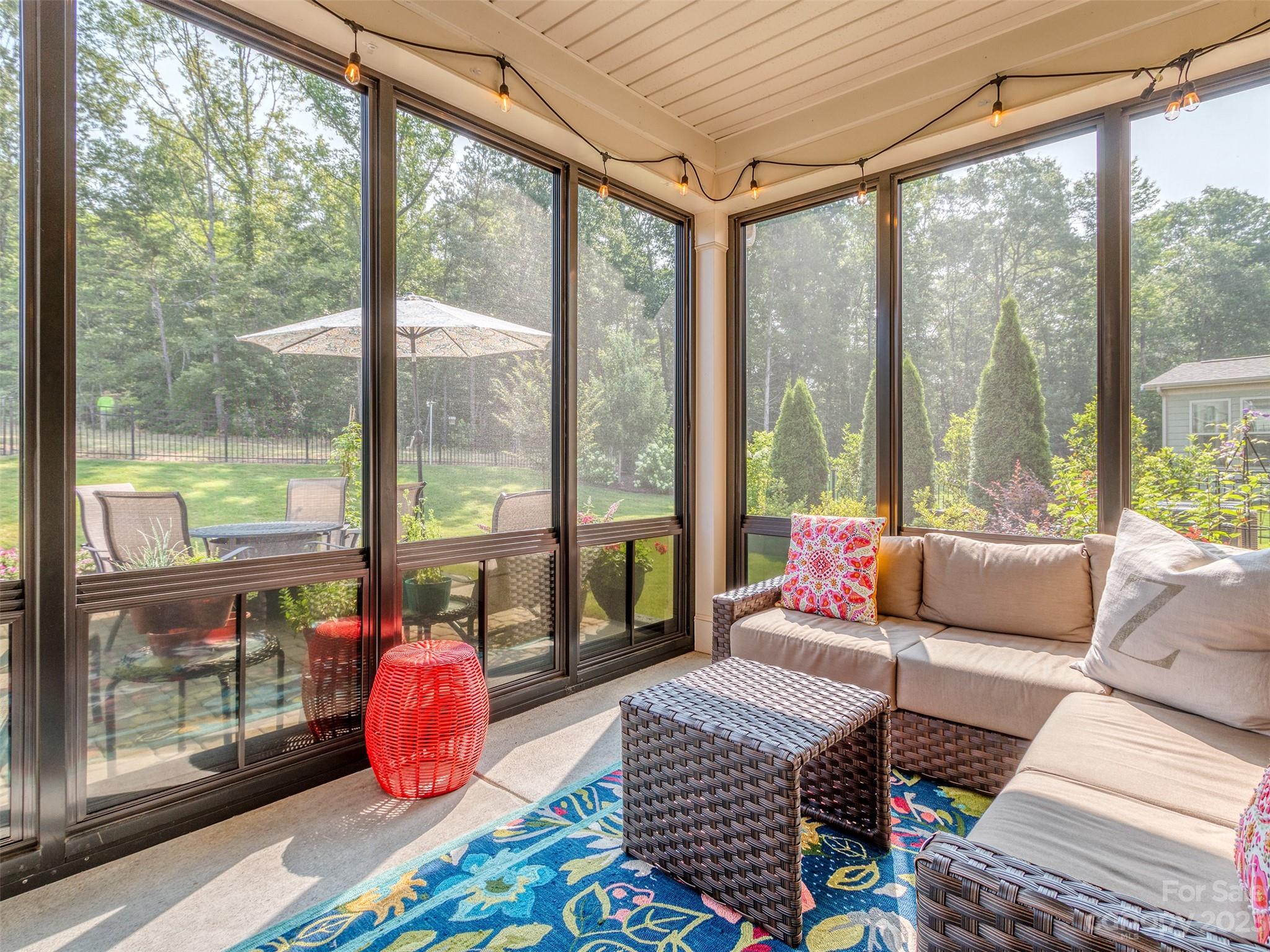 5515 Braddock Ml Way Lancaster, SC 29720 - Photo 31 of 41 a living room with furniture and a floor to ceiling window